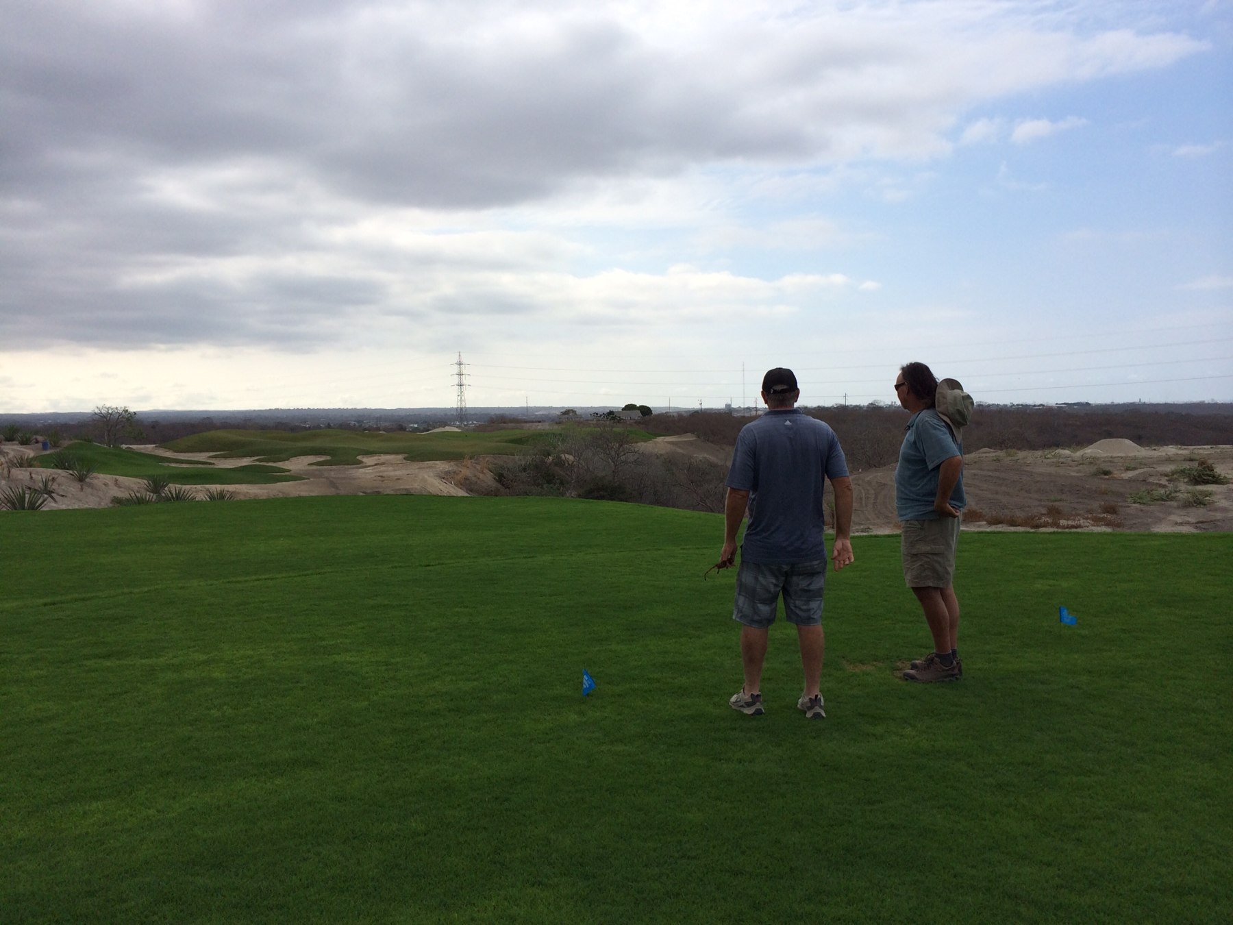 Kris Savignac and Jerry Darrough surveying hole 13 at Montecristi